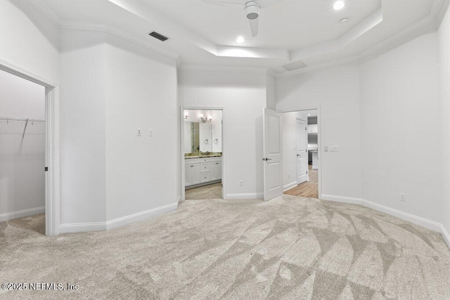 109 Rimini Ct, Jacksonville, FL 32225 - unfurnished bedroom featuring light carpet, a walk in closet, a raised ceiling, ensuite bathroom, and a high ceiling