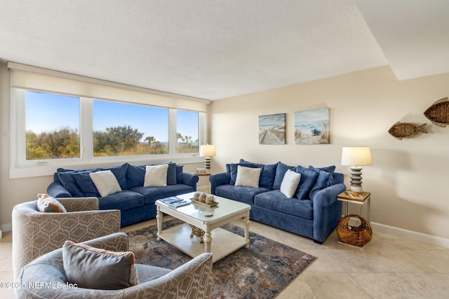 1107 Beach Walker Rd Unit 1107, Amelia Island, FL 32034 - living area featuring baseboards, a textured ceiling, and light tile patterned floors
