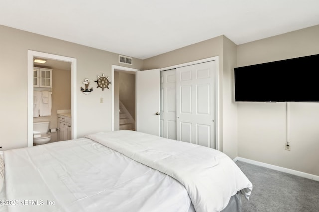 1107 Beach Walker Rd Unit 1107, Amelia Island, FL 32034 - carpeted bedroom with visible vents, connected bathroom, baseboards, and a closet