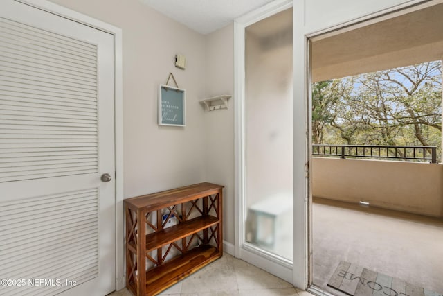 1107 Beach Walker Rd Unit 1107, Amelia Island, FL 32034 - doorway to outside with light tile patterned floors
