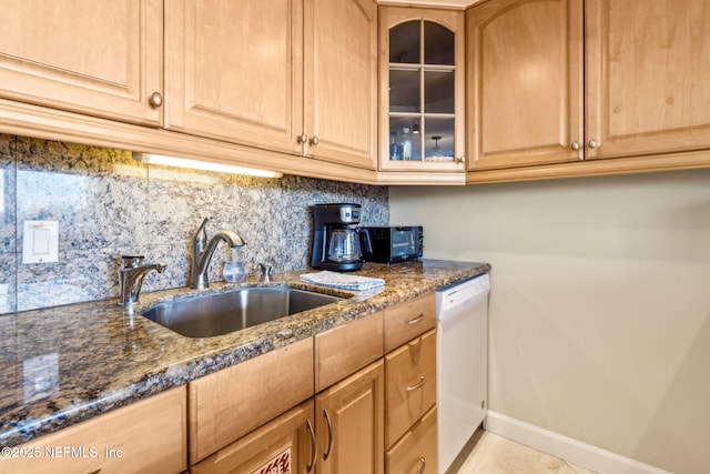 1107 Beach Walker Rd Unit 1107, Amelia Island, FL 32034 - kitchen with a sink, baseboards, dark stone countertops, and dishwasher