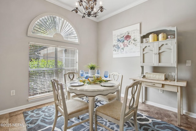 dining area with a chandelier, baseboards, crown molding, and tile patterned floors