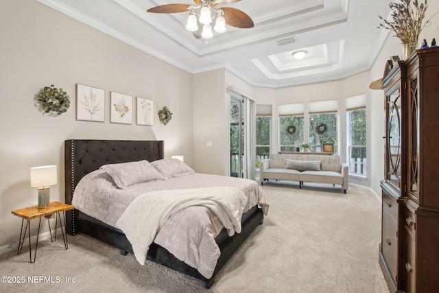 bedroom with carpet flooring, a tray ceiling, ornamental molding, access to outside, and ceiling fan