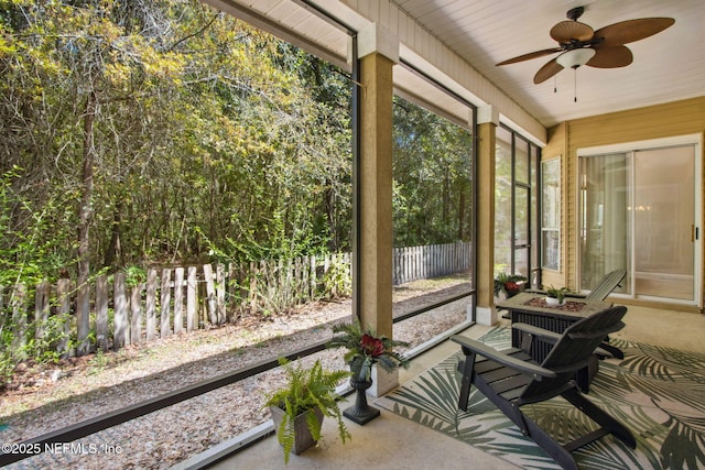 sunroom / solarium featuring ceiling fan