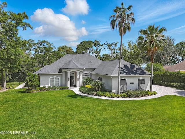 13815 Admirals Bend Dr, Jacksonville, FL 32225 - ranch-style home with stucco siding and a front yard