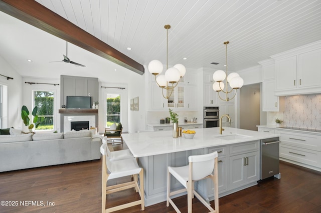 13815 Admirals Bend Dr, Jacksonville, FL 32225 - kitchen featuring backsplash, a sink, light countertops, open floor plan, and stainless steel appliances