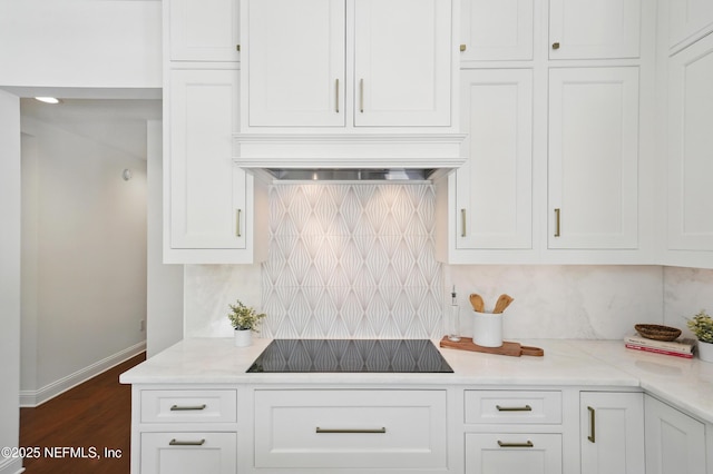 13815 Admirals Bend Dr, Jacksonville, FL 32225 - kitchen with white cabinets, black electric cooktop, baseboards, dark wood-type flooring, and backsplash