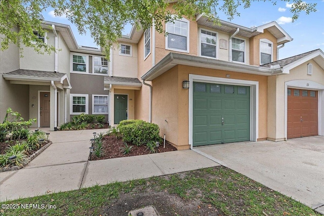 8550 Argyle Business Loop Unit 407, Jacksonville, FL 32244 - view of property featuring stucco siding, concrete driveway, and an attached garage