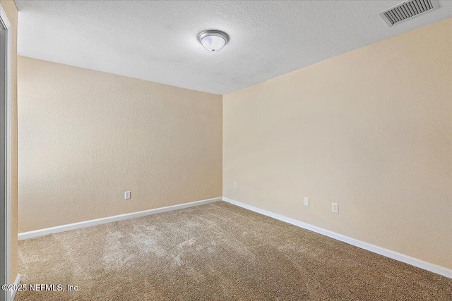 8550 Argyle Business Loop Unit 407, Jacksonville, FL 32244 - unfurnished room with carpet flooring, baseboards, and a textured ceiling