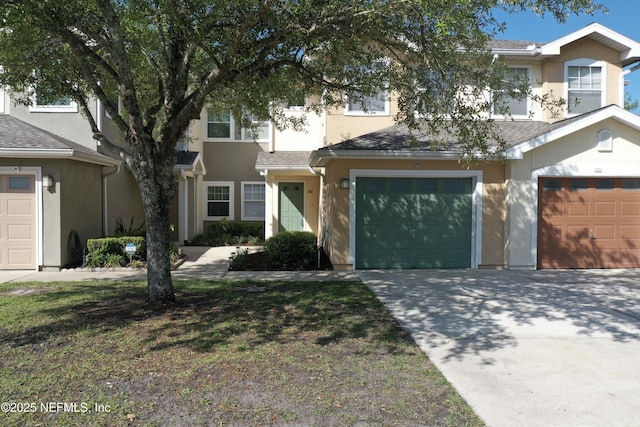 8550 Argyle Business Loop Unit 407, Jacksonville, FL 32244 - view of front of property featuring stucco siding, driveway, and an attached garage