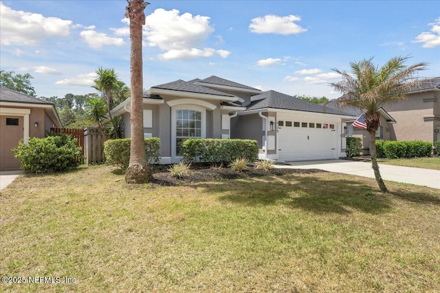 view of front of home featuring concrete driveway, an attached garage, a front lawn, and stucco siding