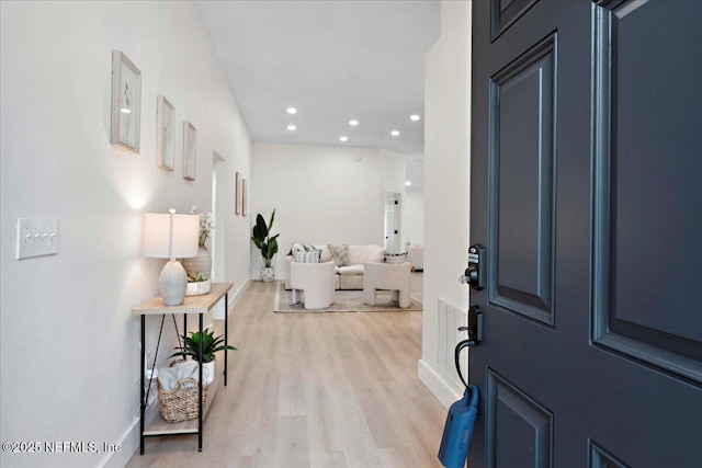 entrance foyer with recessed lighting, baseboards, and light wood-type flooring