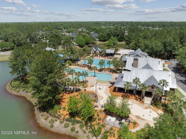 birds eye view of property with a wooded view