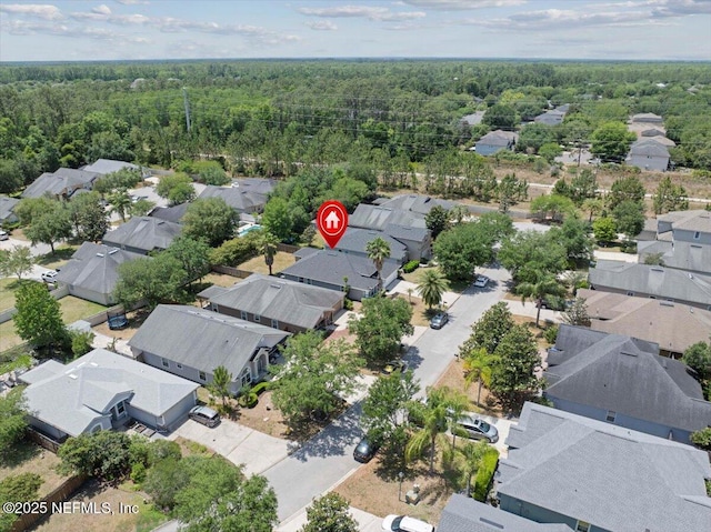 aerial view featuring a view of trees and a residential view