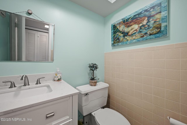 1830 Sevilla Blvd Unit 208, Atlantic Beach, FL 32233 - half bath featuring toilet, tile walls, and vanity