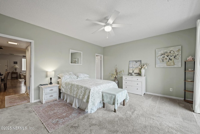 1830 Sevilla Blvd Unit 208, Atlantic Beach, FL 32233 - bedroom featuring carpet floors, baseboards, a textured ceiling, and a ceiling fan