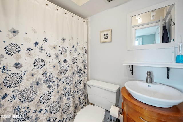 1830 Sevilla Blvd Unit 208, Atlantic Beach, FL 32233 - full bathroom featuring toilet, a shower with shower curtain, and vanity