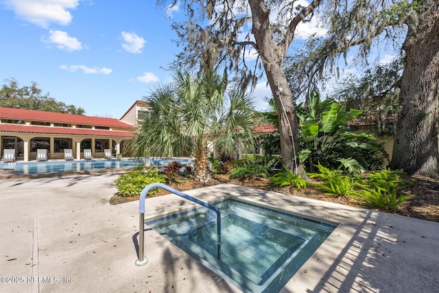 1830 Sevilla Blvd Unit 208, Atlantic Beach, FL 32233 - community pool featuring a community hot tub and a patio area