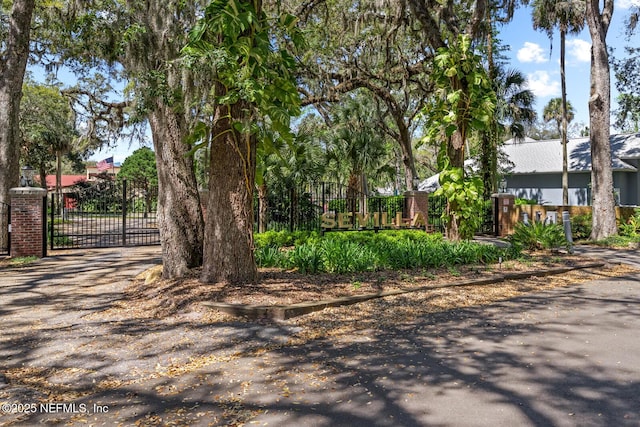 1830 Sevilla Blvd Unit 208, Atlantic Beach, FL 32233 - view of asphalt driveway featuring a gate