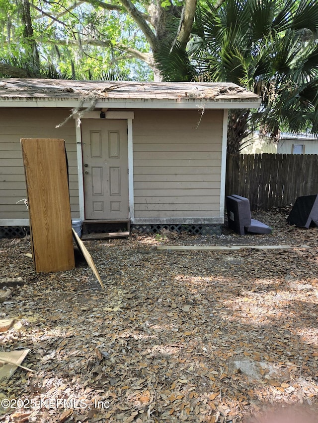 565 Starratt Rd, Jacksonville, FL 32218 - view of shed featuring fence
