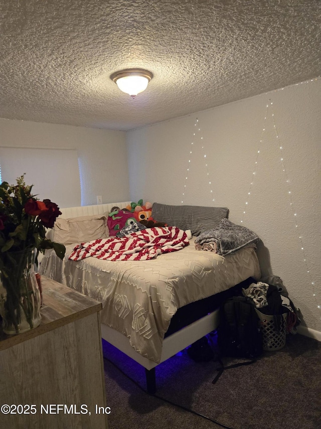 565 Starratt Rd, Jacksonville, FL 32218 - carpeted bedroom featuring a textured ceiling