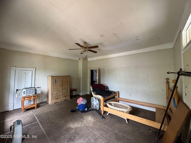 unfurnished room featuring carpet, a ceiling fan, and a textured ceiling