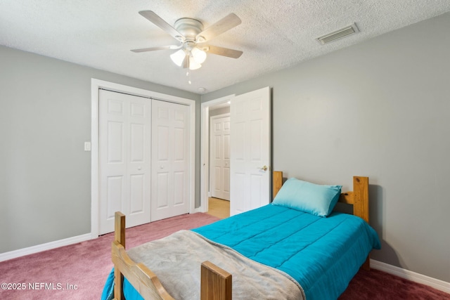 bedroom featuring baseboards, carpet, a closet, and visible vents