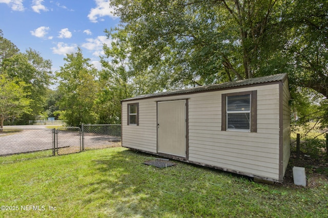 view of shed featuring fence