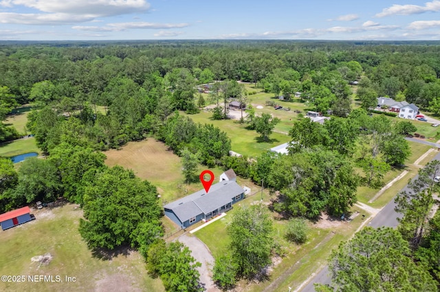 aerial view with a wooded view