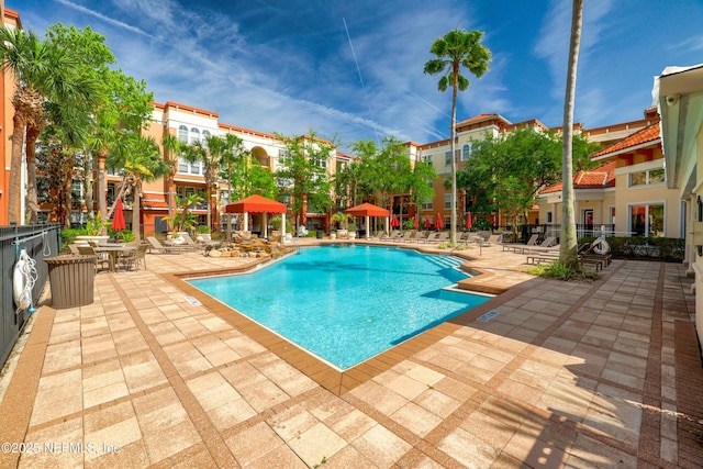 pool with a patio area
