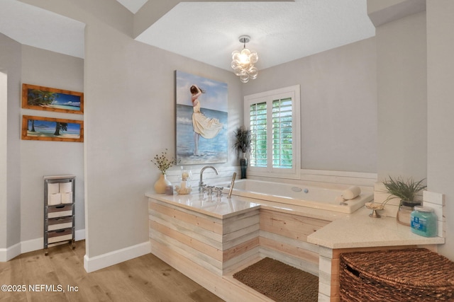3626 Kapalua Ct, Green Cove Springs, FL 32043 - full bath with baseboards, an inviting chandelier, wood finished floors, and a bath