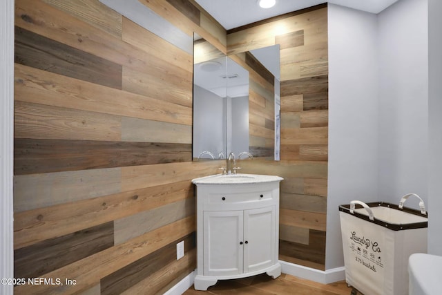 3626 Kapalua Ct, Green Cove Springs, FL 32043 - bathroom with vanity, wood walls, and wood finished floors