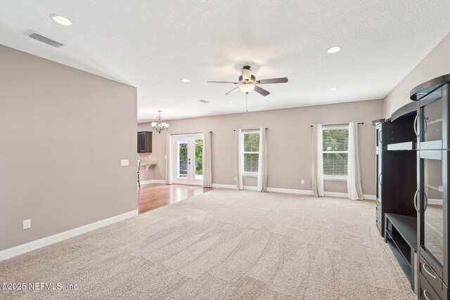 2968 Ravine Hill Dr, Middleburg, FL 32068 - unfurnished living room with a ceiling fan, light colored carpet, recessed lighting, a chandelier, and baseboards