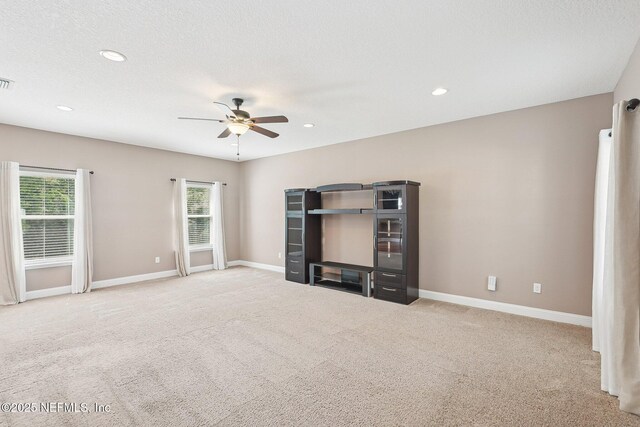 2968 Ravine Hill Dr, Middleburg, FL 32068 - unfurnished living room with ceiling fan, carpet floors, plenty of natural light, and recessed lighting