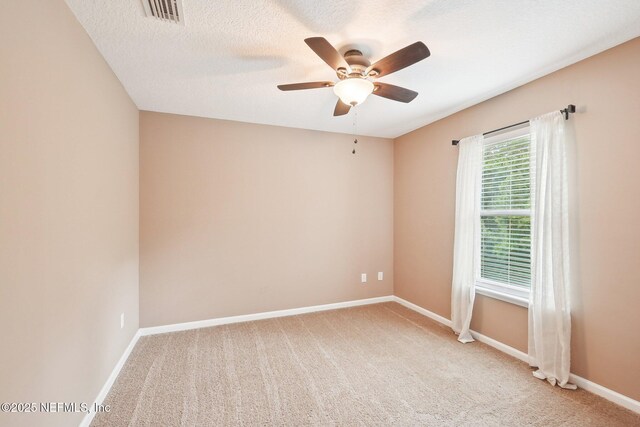2968 Ravine Hill Dr, Middleburg, FL 32068 - empty room with a ceiling fan, light colored carpet, baseboards, and a textured ceiling