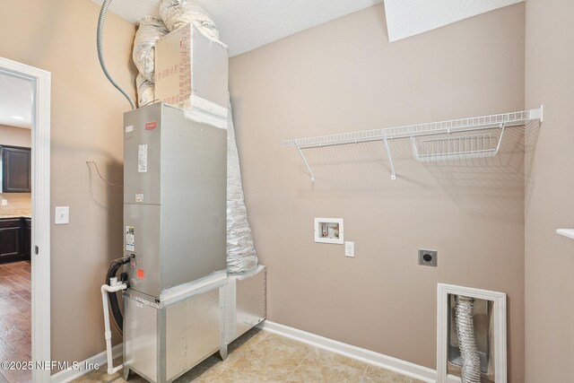 2968 Ravine Hill Dr, Middleburg, FL 32068 - laundry area with electric dryer hookup, washer hookup, and baseboards