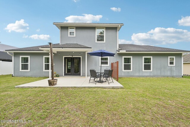 2968 Ravine Hill Dr, Middleburg, FL 32068 - rear view of house featuring a patio area, a yard, stucco siding, and roof with shingles