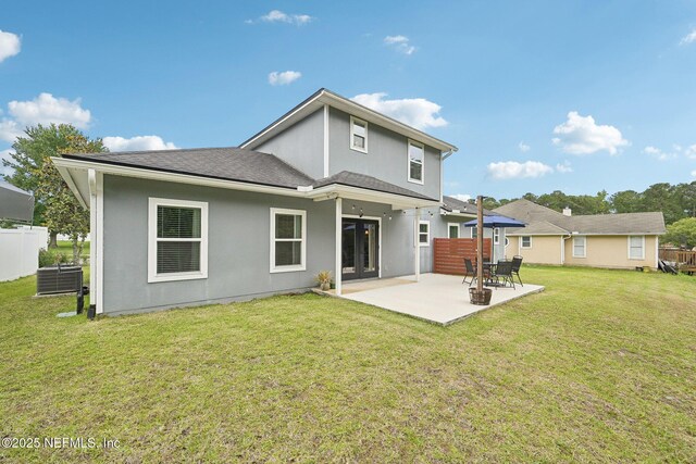 2968 Ravine Hill Dr, Middleburg, FL 32068 - back of house featuring a patio area, central AC, stucco siding, and a shingled roof