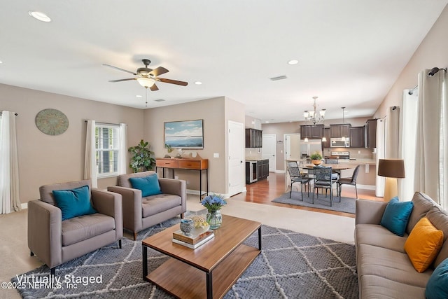 2968 Ravine Hill Dr, Middleburg, FL 32068 - living room featuring ceiling fan, a chandelier, baseboards, and recessed lighting
