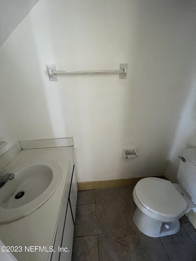 2673 Trollie Ln Unit 1, Jacksonville, FL 32211 - bathroom with toilet, tile patterned floors, baseboards, and vanity