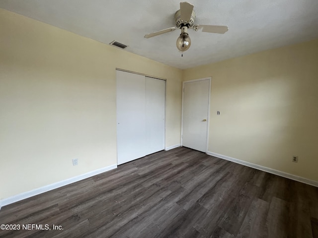2673 Trollie Ln Unit 1, Jacksonville, FL 32211 - unfurnished bedroom with baseboards, visible vents, dark wood-style floors, and a closet