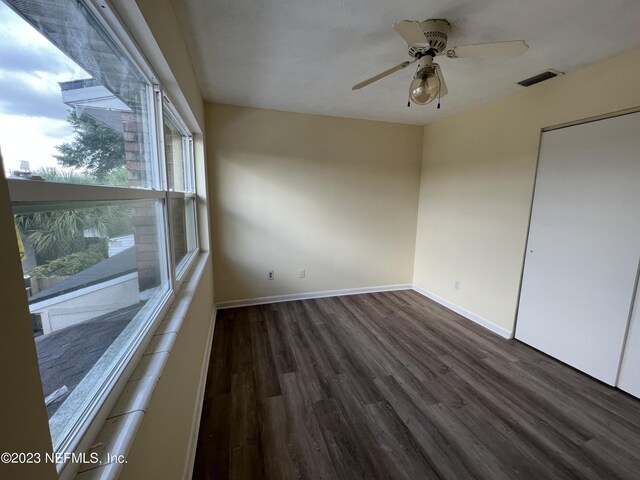 2673 Trollie Ln Unit 1, Jacksonville, FL 32211 - empty room featuring baseboards, a ceiling fan, wood finished floors, and visible vents