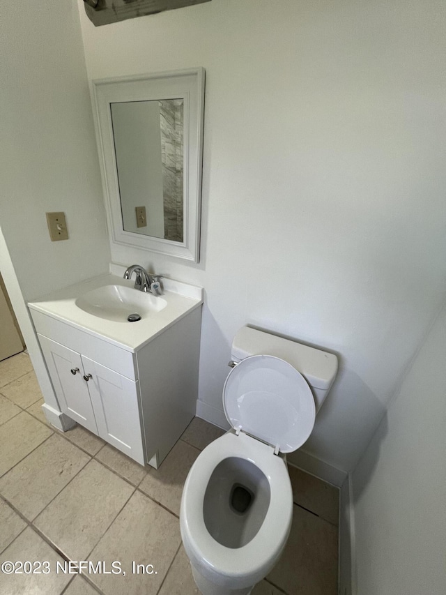 2673 Trollie Ln Unit 1, Jacksonville, FL 32211 - bathroom featuring vanity, baseboards, tile patterned flooring, and toilet
