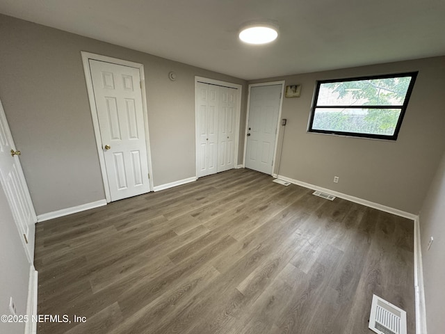 5612 Oliver St, Jacksonville, FL 32211 - unfurnished bedroom with wood finished floors, visible vents, and baseboards