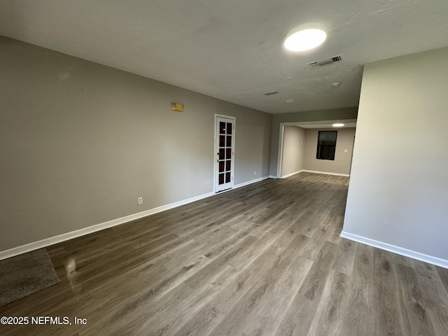 5612 Oliver St, Jacksonville, FL 32211 - empty room featuring wood finished floors, visible vents, and baseboards