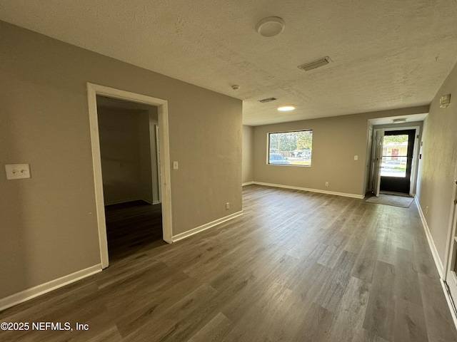 5612 Oliver St, Jacksonville, FL 32211 - unfurnished room with a textured ceiling, wood finished floors, and baseboards