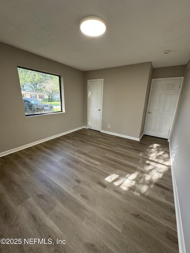 5612 Oliver St, Jacksonville, FL 32211 - interior space featuring dark wood finished floors and baseboards