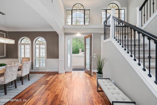 725 Carthage Pl, Saint Johns, FL 32259 - entryway with wood finished floors, stairway, a decorative wall, wainscoting, and ornamental molding