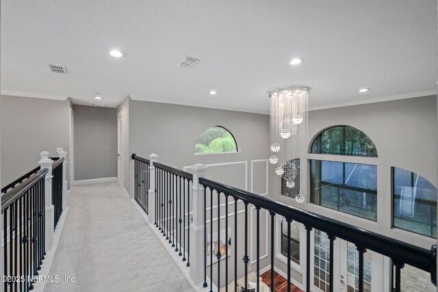 725 Carthage Pl, Saint Johns, FL 32259 - hallway featuring a chandelier, recessed lighting, an upstairs landing, and crown molding