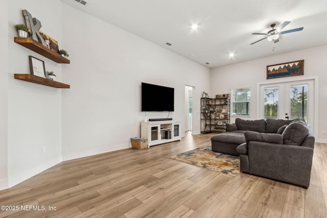 36039 Pitch Ln, Hilliard, FL 32046 - living area with light wood finished floors, a ceiling fan, french doors, recessed lighting, and baseboards